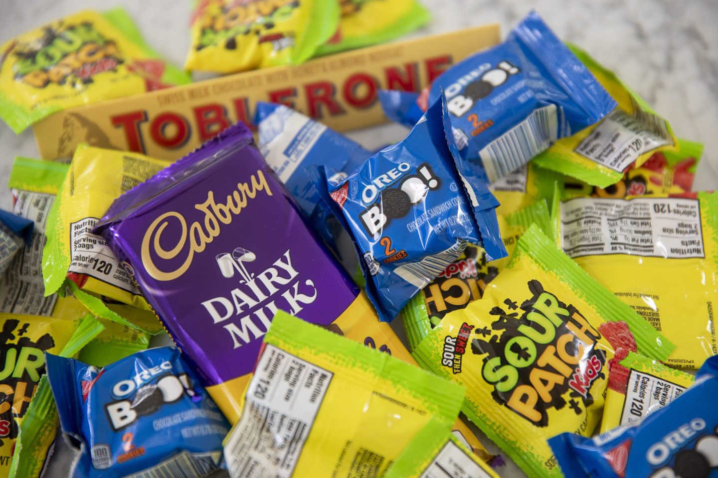 Sour Patch Kids, Oreos, and Cadbury chocolate, is displayed
