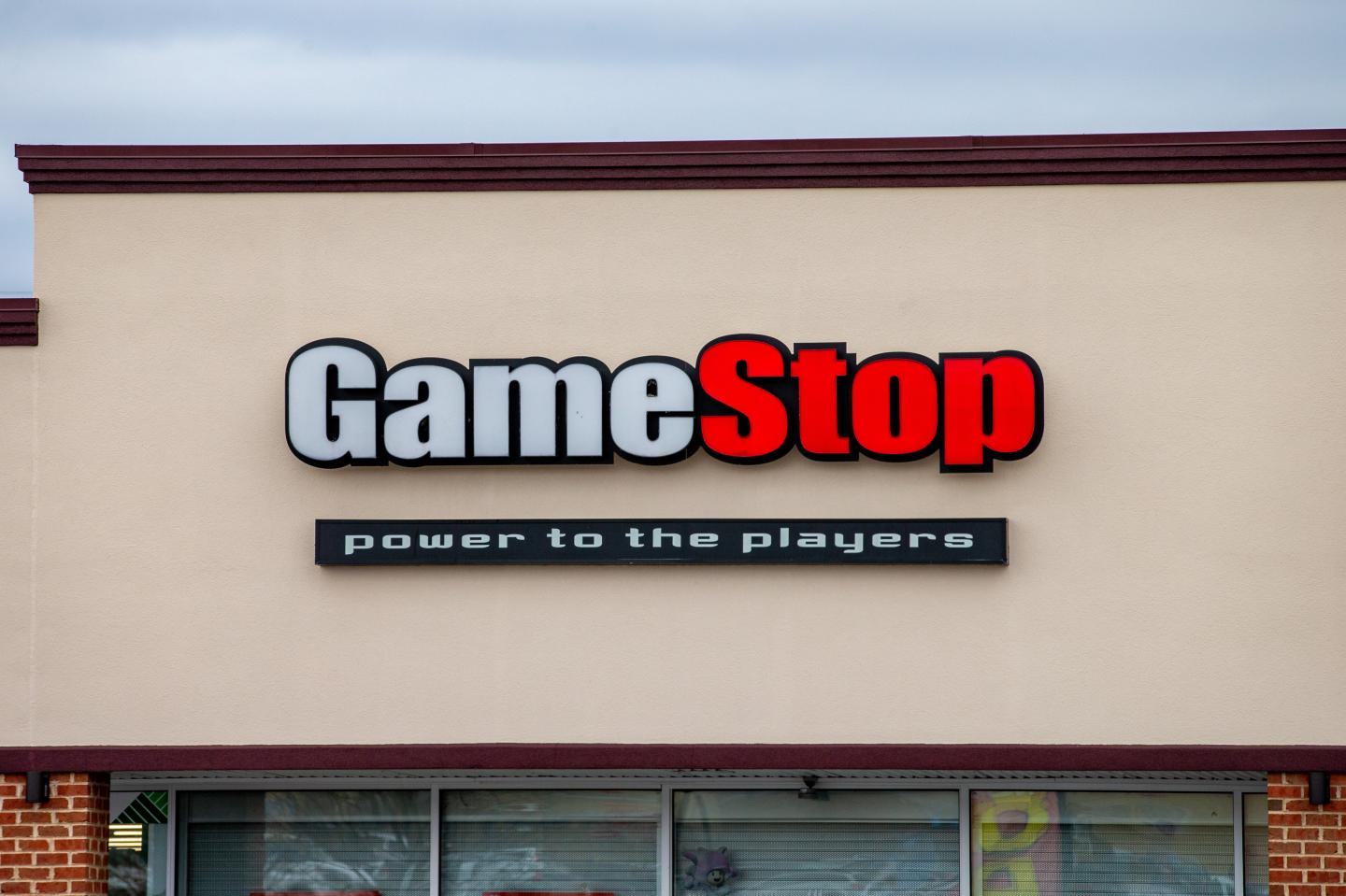 A GameStop storefront in a strip mall.
