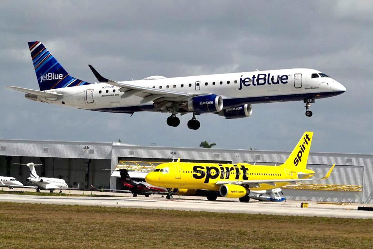 Two airplanes at an airport.