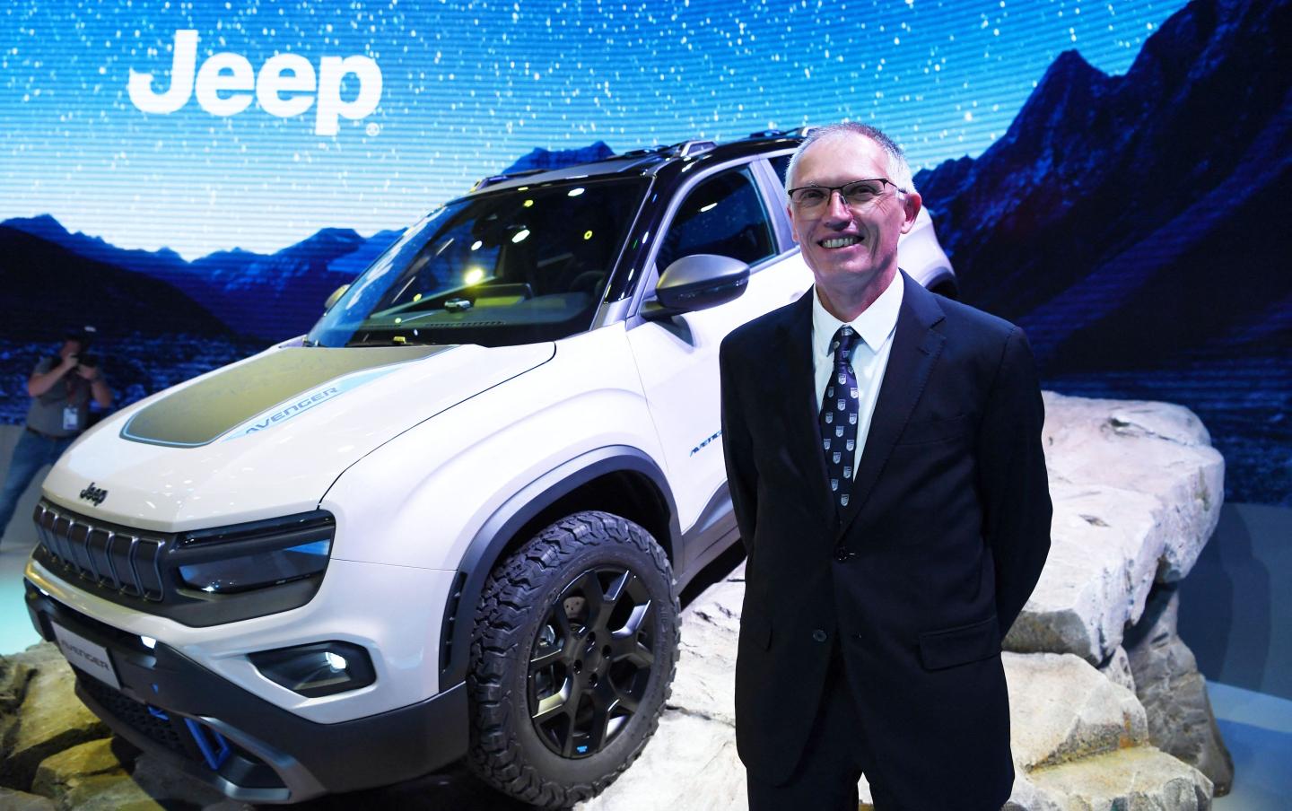 CEO of Stellantis Carlos Tavares poses following the presentation of the Jeep Avenger 4Xe Concept, on the first day of the 2022 Paris auto show.