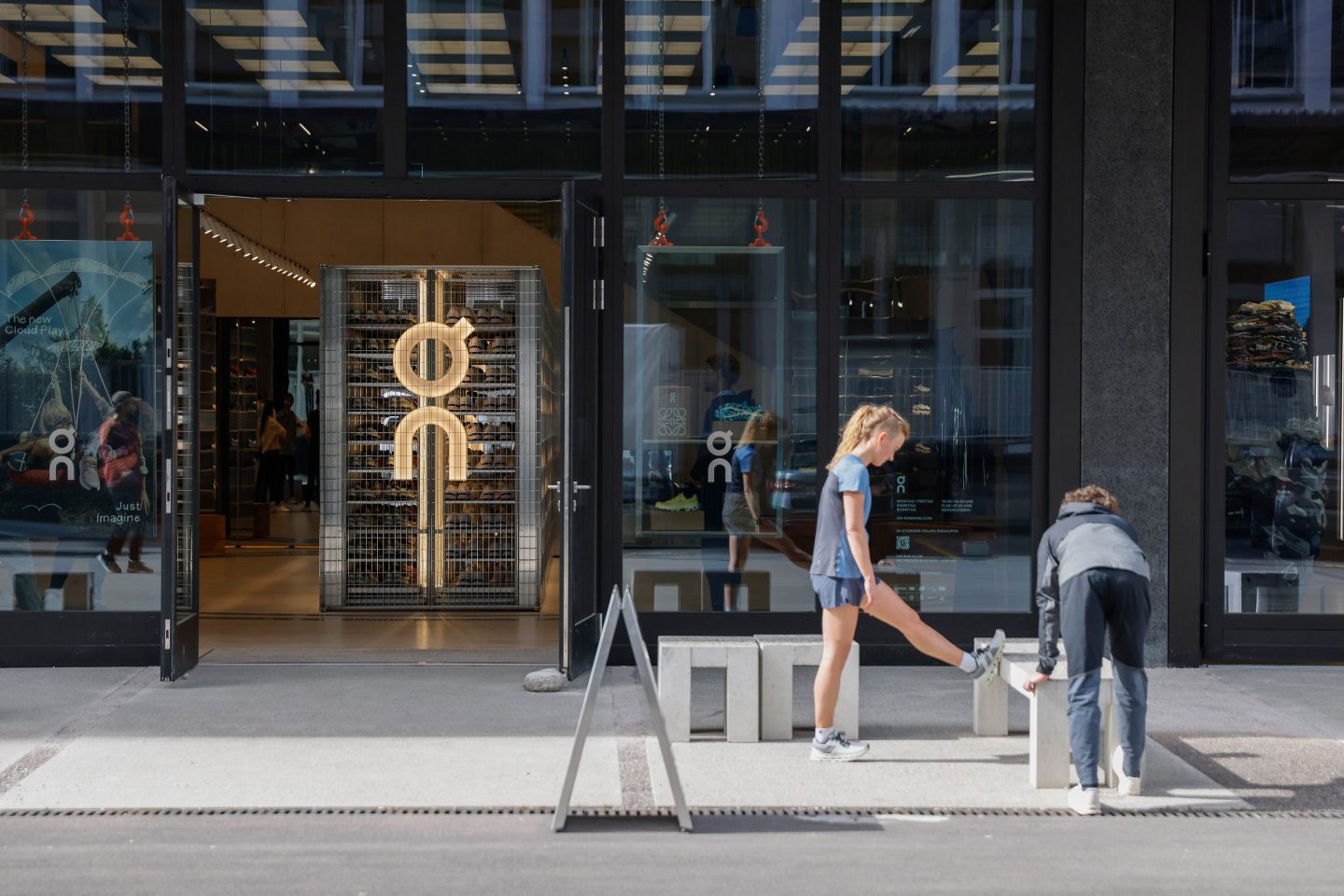 person standing outside an On store