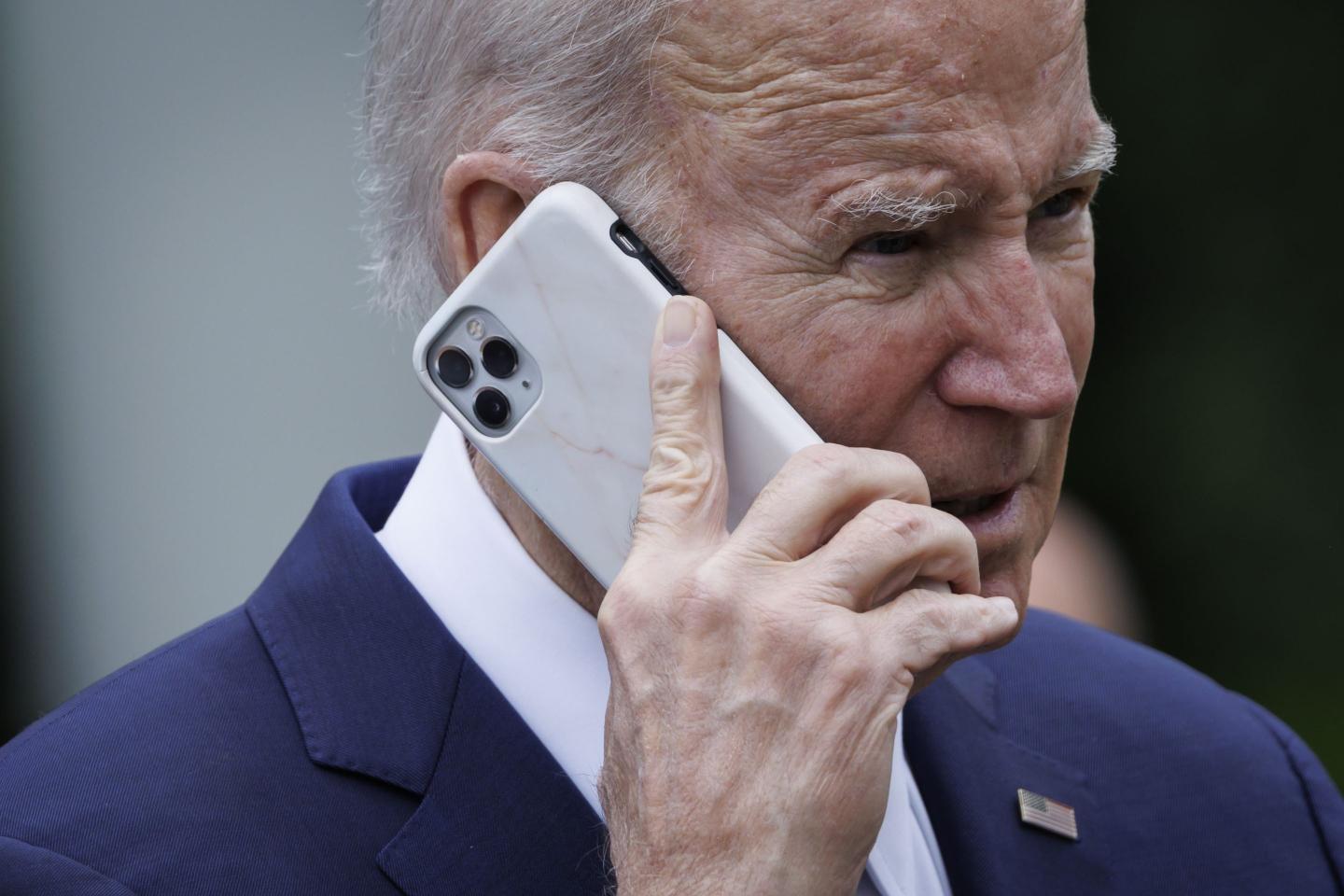 US President Joe Biden on a smartphone