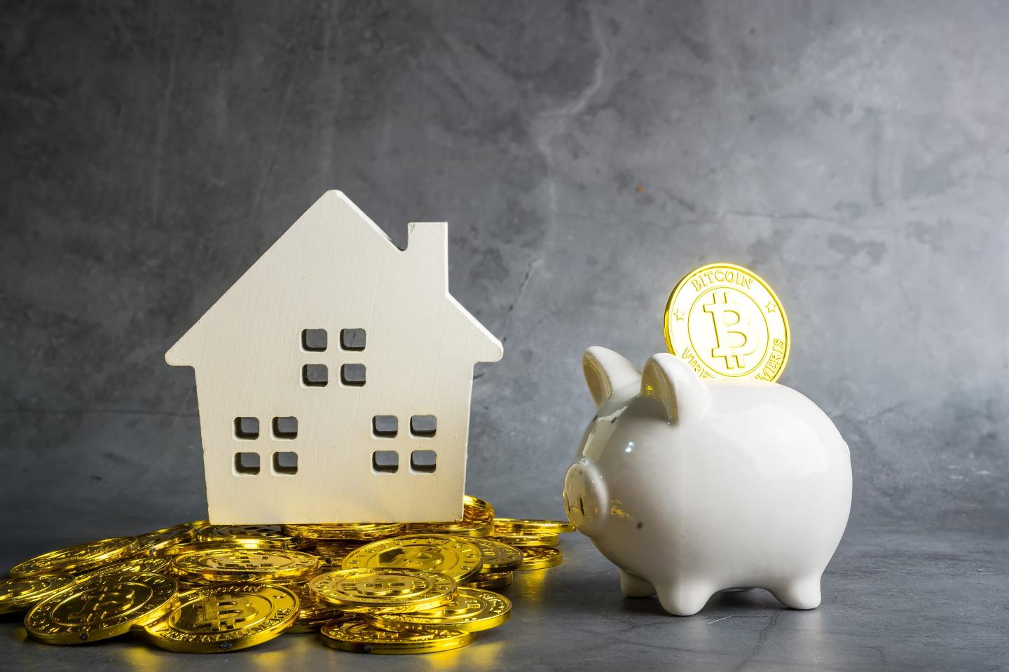 bitcoin with house and piggy bank