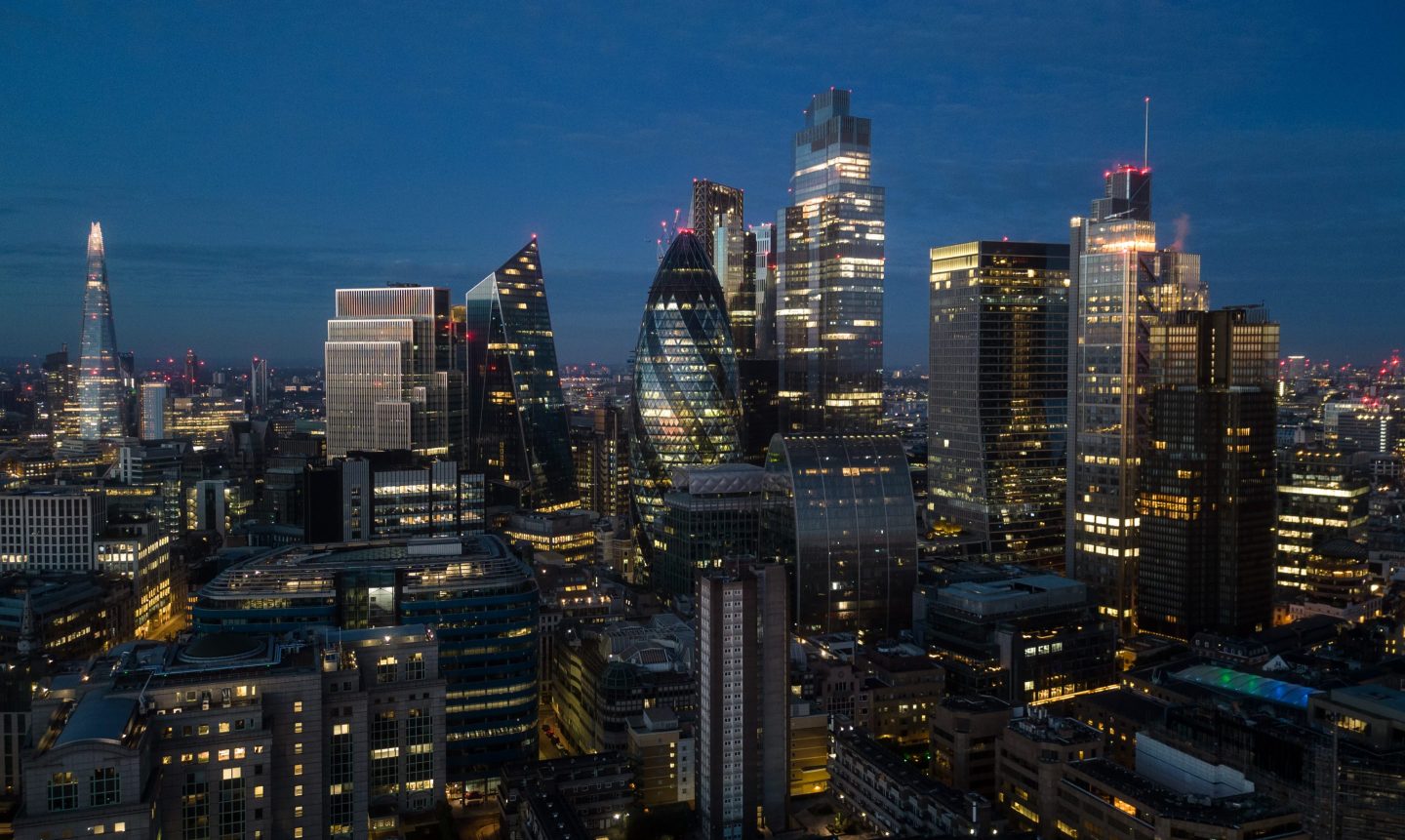 Aerial view of the City of London skyscrapers at night