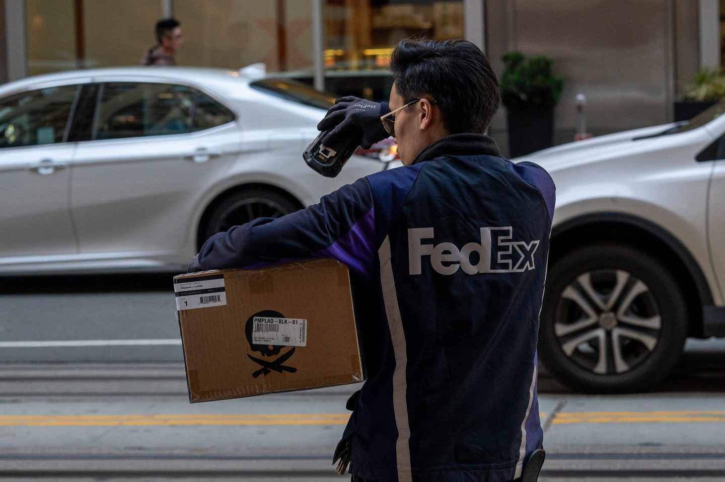 A FedEx courier delivers packages on Cyber Monday in San Francisco, California.