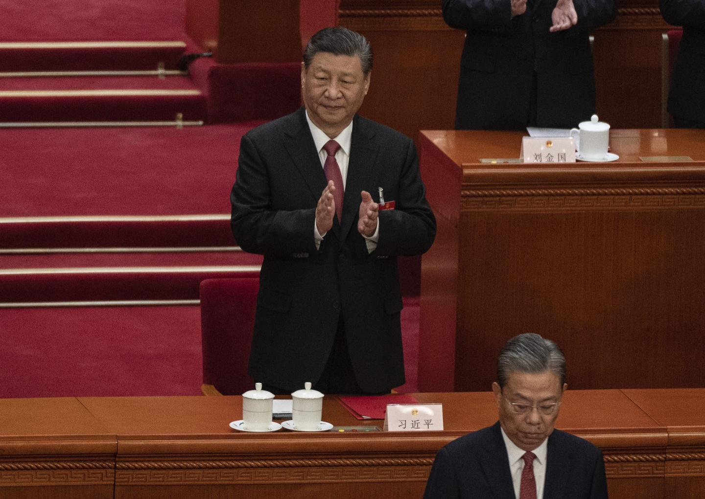 Chinese President Xi Jinping applauds