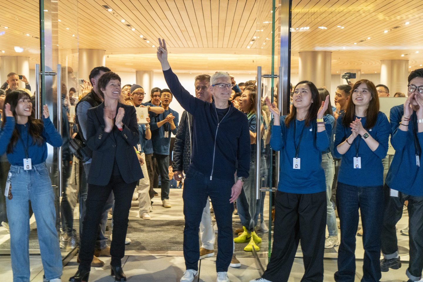 Tim Cook in front of Apple store