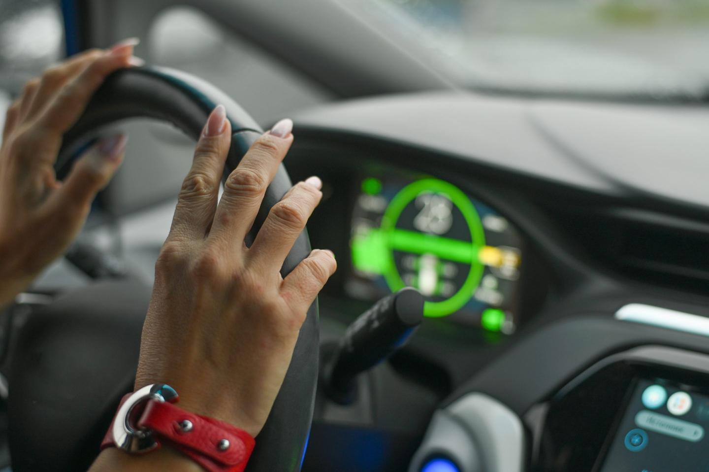 A woman driving a modern car