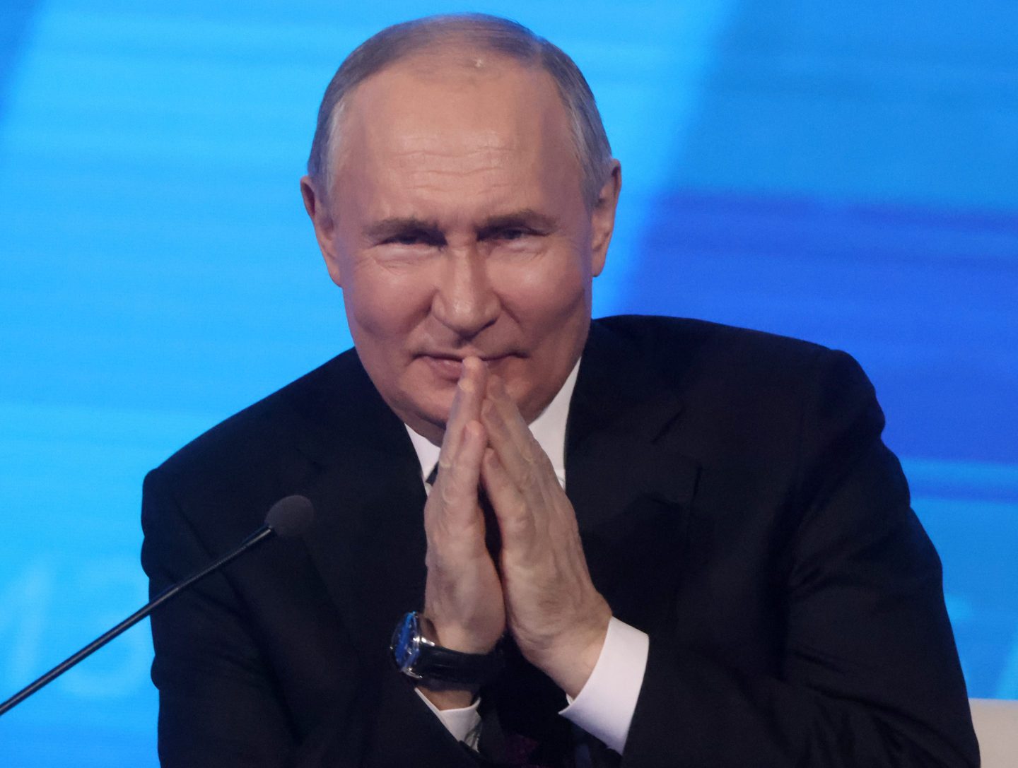Vladimir Putin puts his hands together