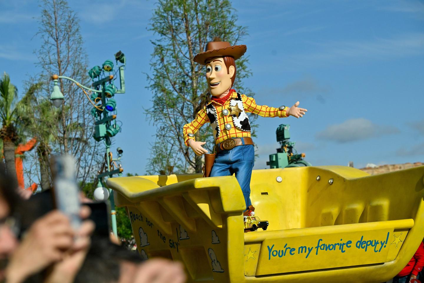 Woody from Toy Story rides in a truck during the "Better Together: A Pixar Pals Celebration!"