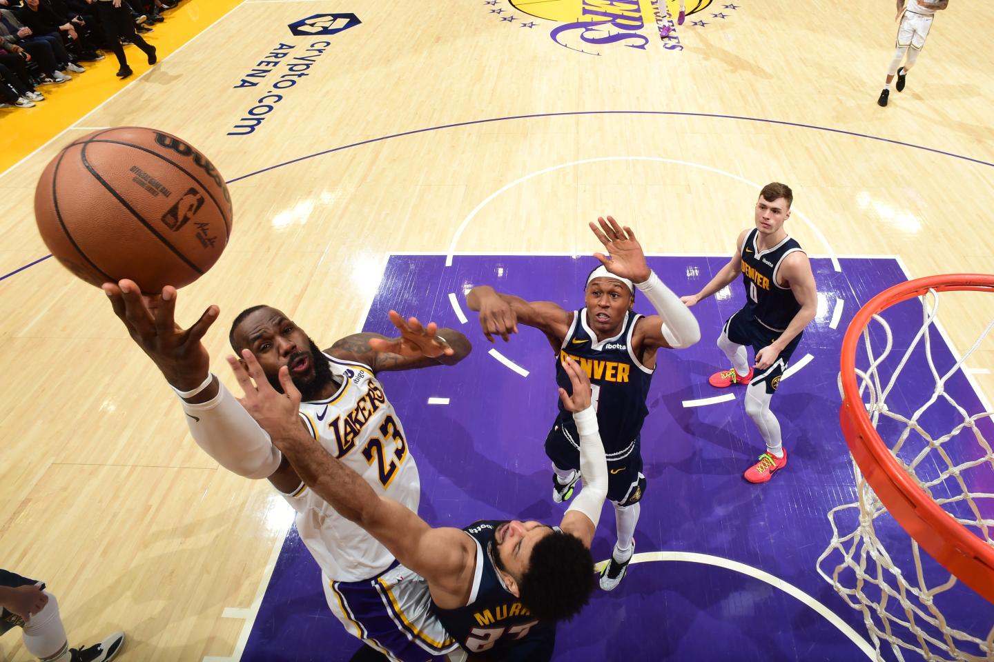 Los Angeles Laker LeBron James goes up for a basket against the Denver Nuggets.