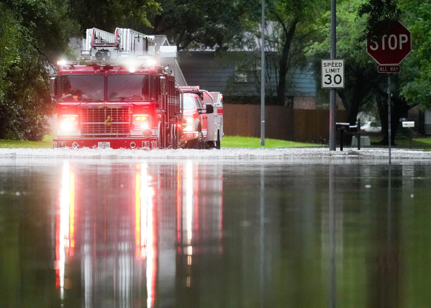 KINGWOOD, TEXAS &#8211; MAY 2: A Houston firetruck makes it way through flood water in North Woodland Hills after severe flooding, Thursday, May 2, 2024, in Kingwood. (Jason Fochtman/Houston Chronicle via Getty Images)