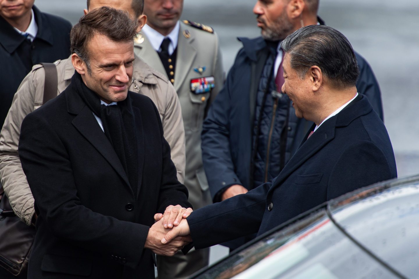 Emmanuel Macron, France's president, left, greets Xi Jinping, China's president, after arriving at Tarbes-Lourdes Pyrenees airport, in Tarbes, France, on Tuesday, May 7, 2024.