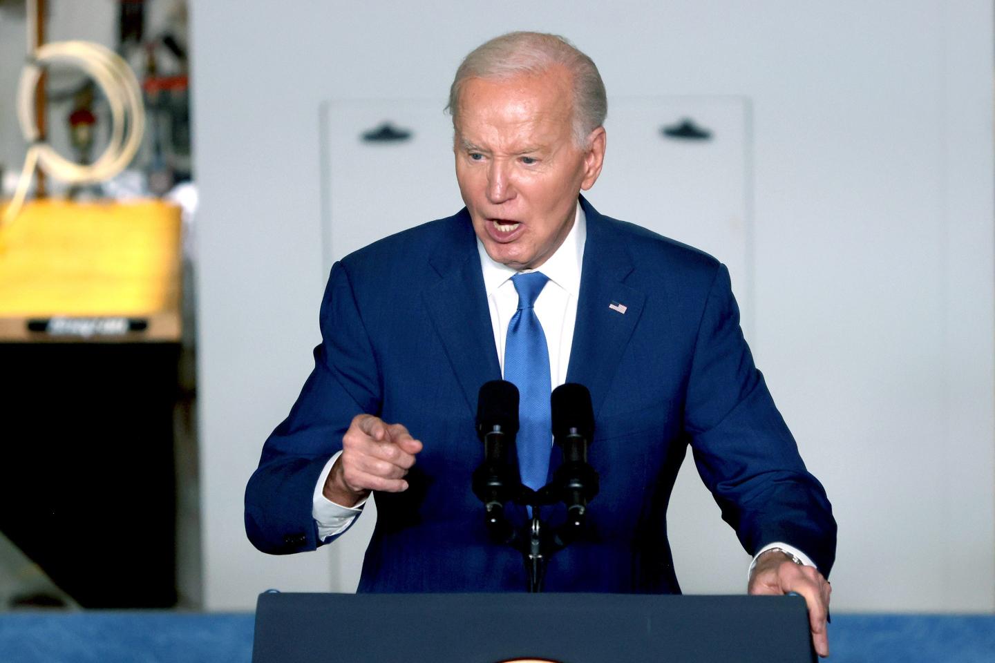 Joe Biden speaking at a podium.