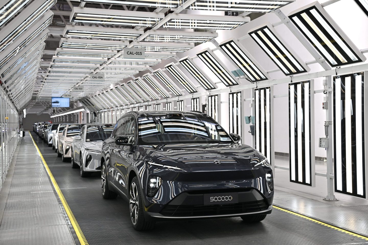 electric cars roll off assembly line