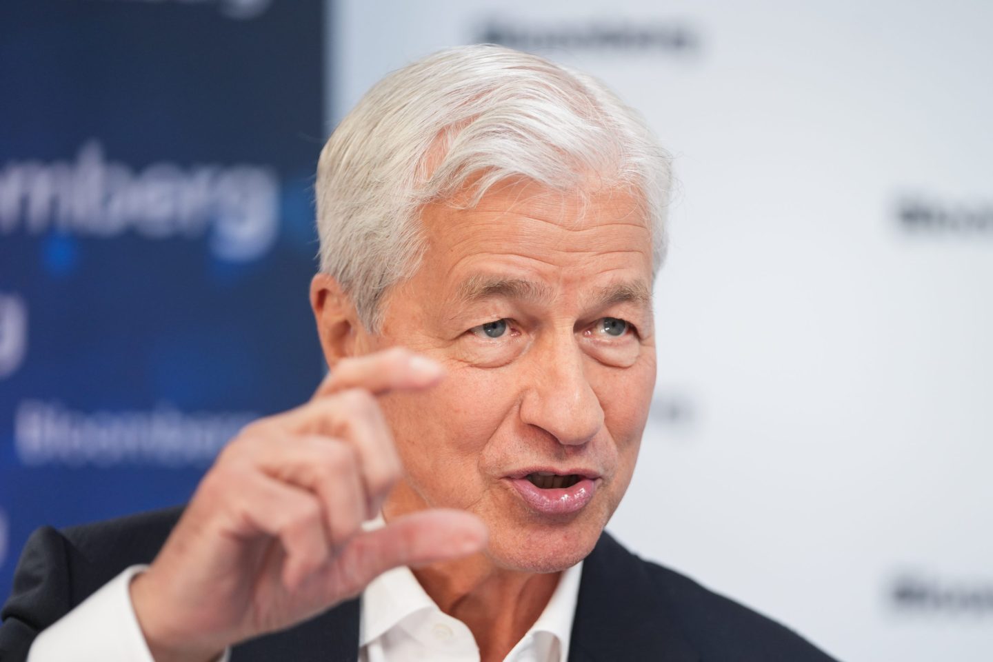 JPMorgan Chase CEO Jamie Dimon urged the U.S. once again to reduce its national deficit, warning it will become “far more uncomfortable” if financial markets force the government’s hand.