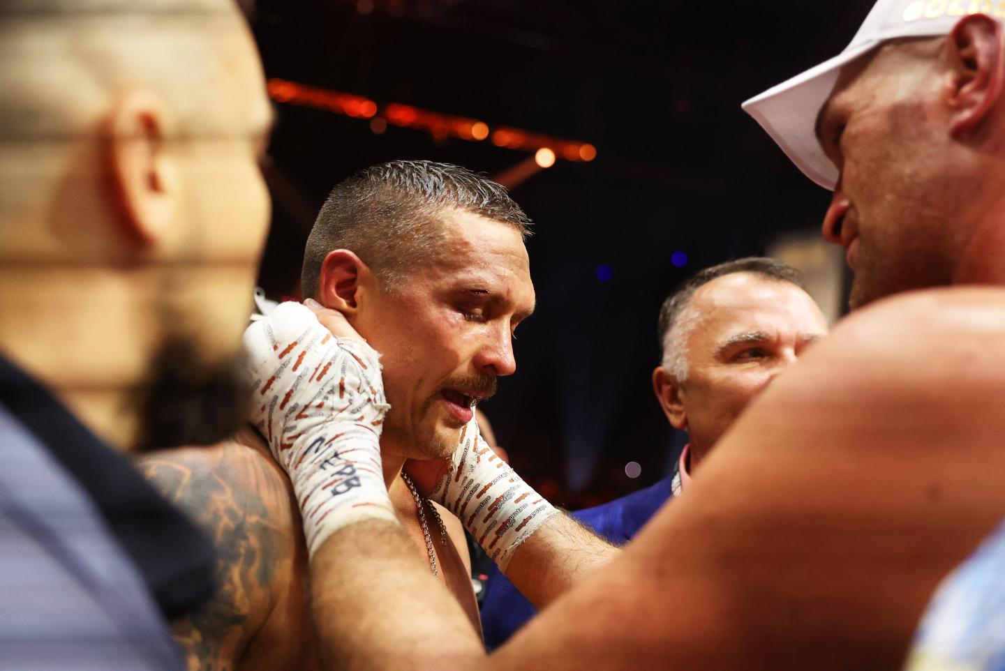 Tyson Fury embraces Oleksandr Usyk.