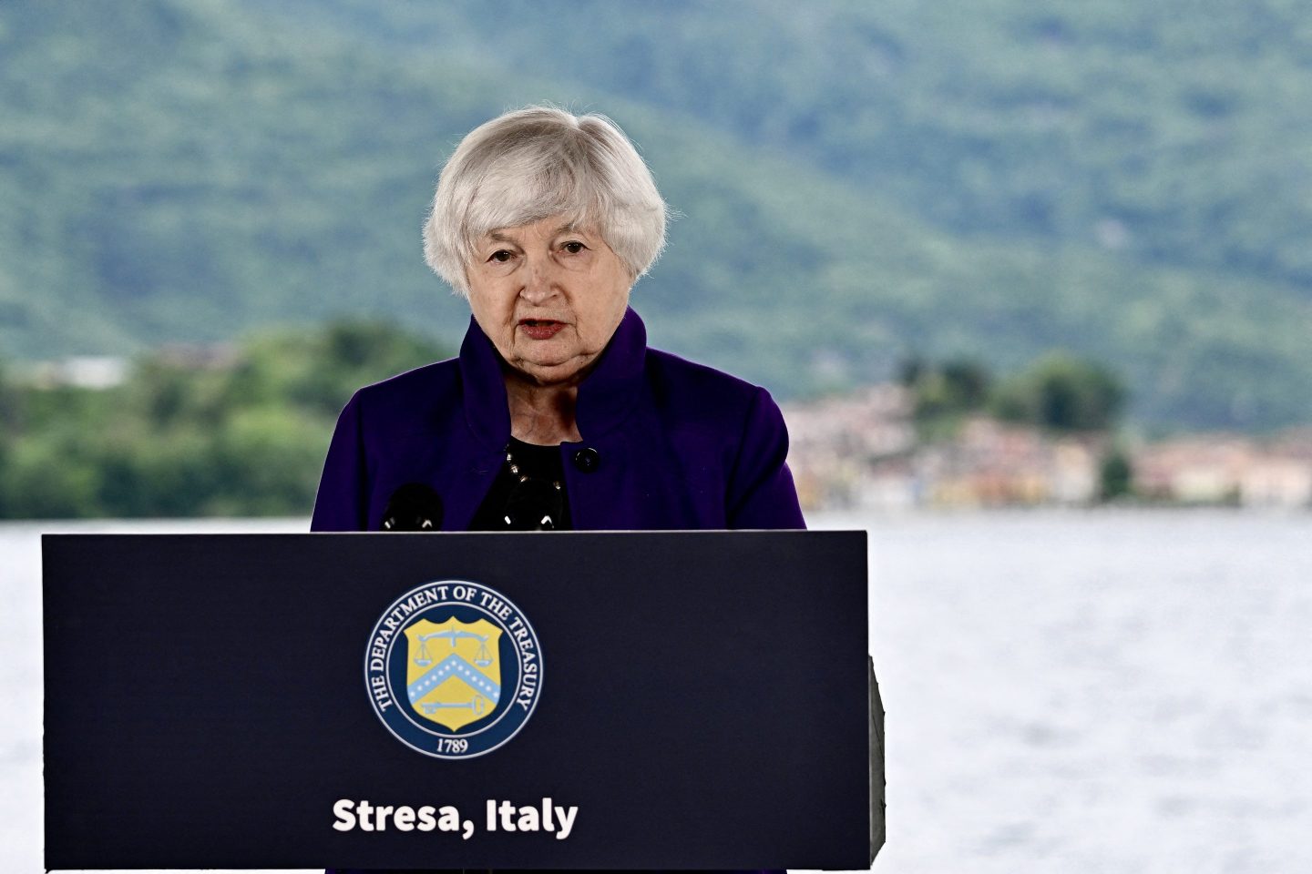 Treasury Secretary Janet Yellen stands at podium