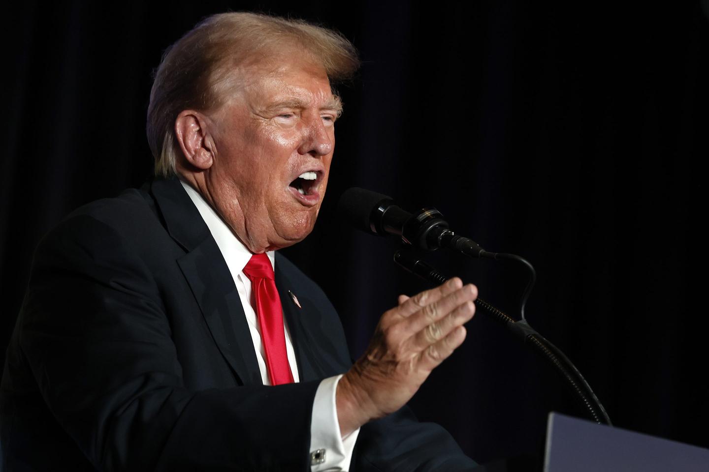 Donald Trump speaks at podium