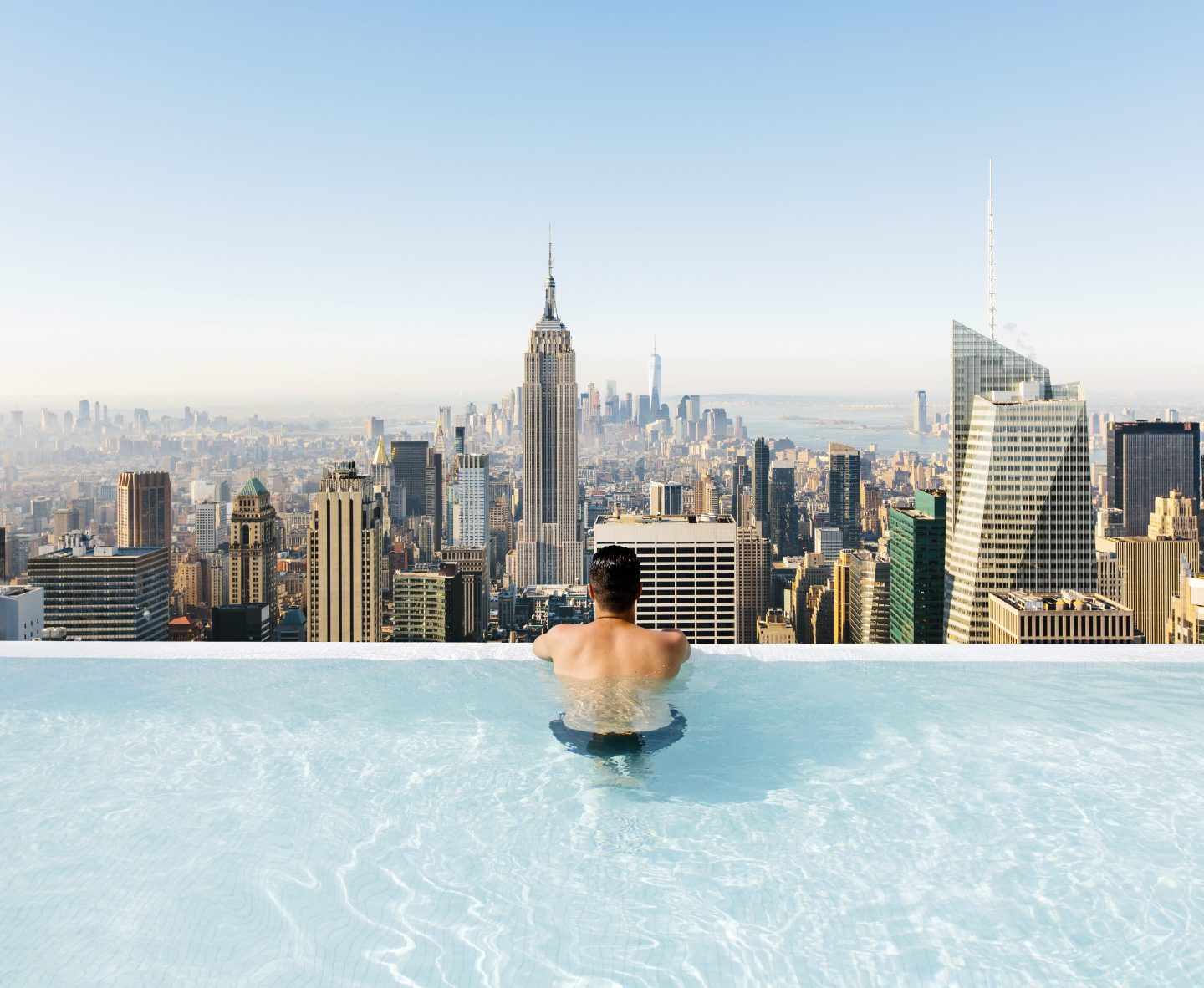 man relaxing in a swimming pool