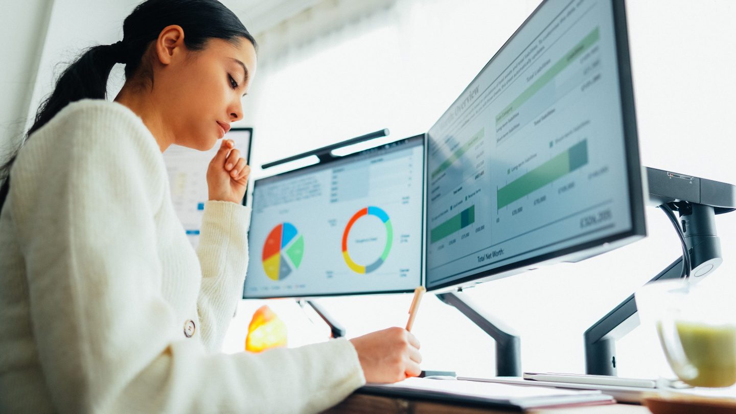 Woman working at standing desk home office.