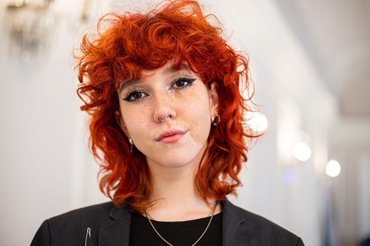 Portrait of young red headed woman.
