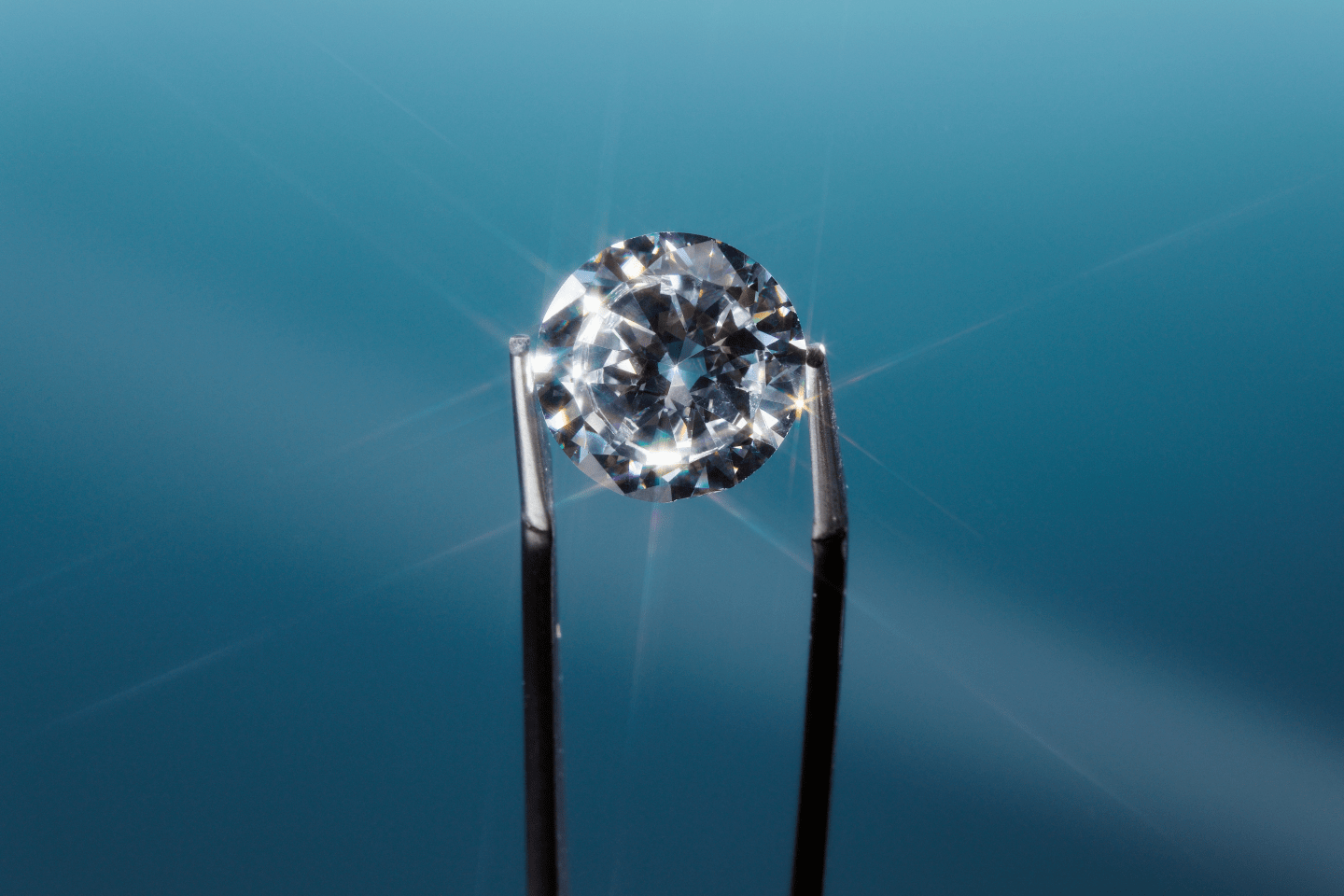Tweezers holding diamond, close-up