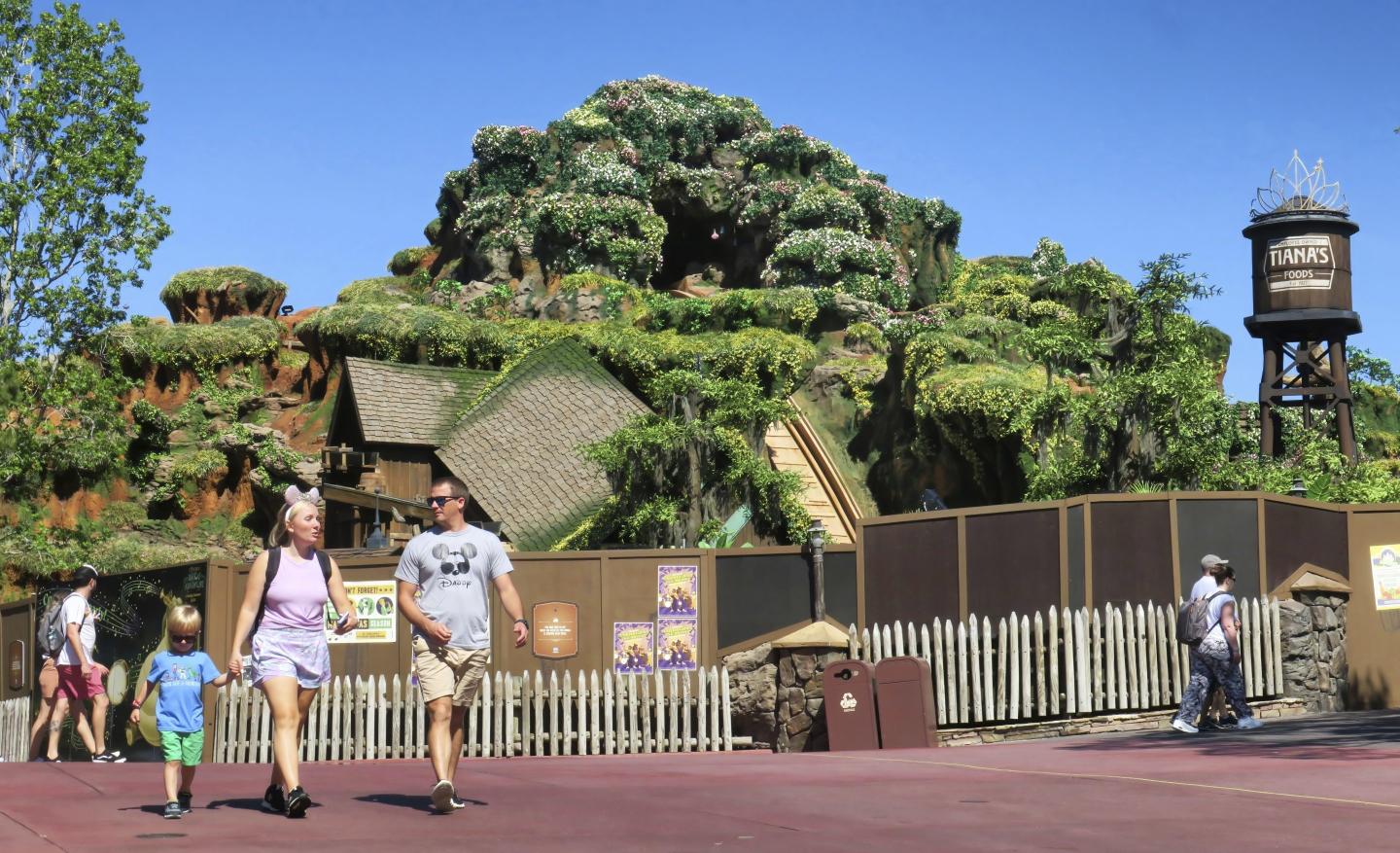 Guests pass by Tiana's Bayou Adventure, the reimagined former Splash Mountain ride in the Magic Kingdom at Walt Disney World, as work continues on May 23, 2024, ahead of its planned June 28 opening in Bay Lake, Fla.