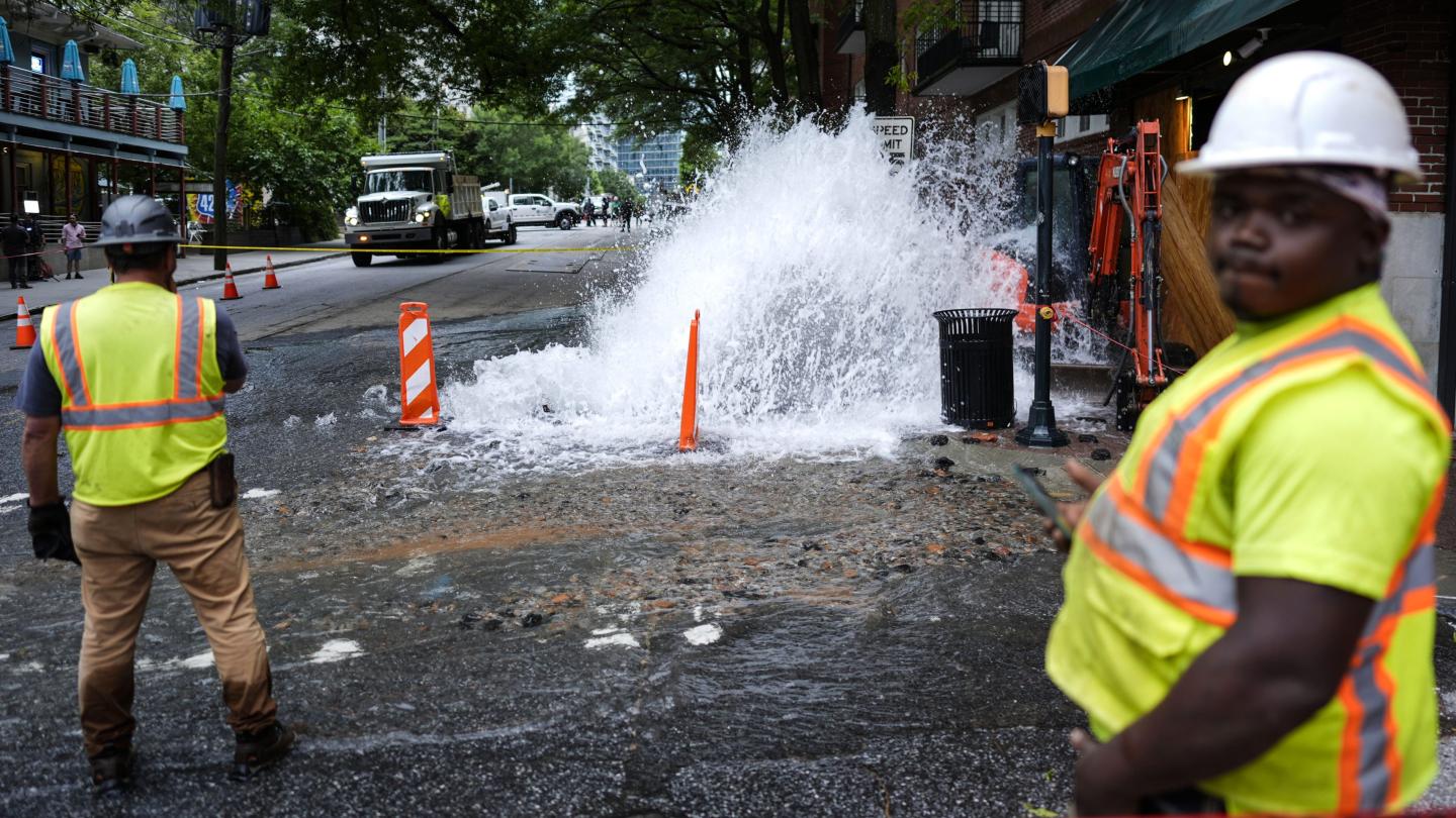 A gushing water pipe in the street