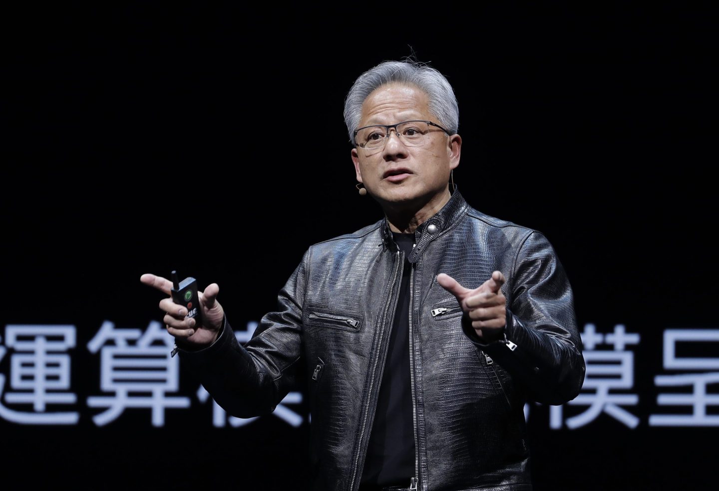 Nvidia CEO Jensen Huang talks on stage
