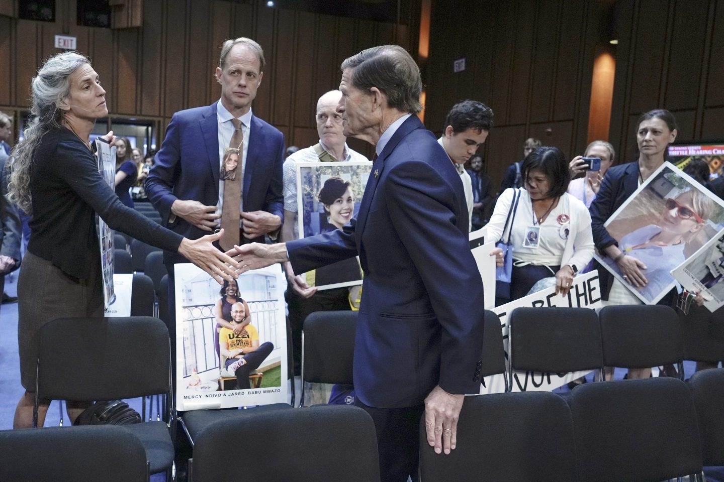 Sen. Richard Blumenthal, D-Conn., center, visits with family members of victims of Boeing plane crashes after a Senate Homeland Security Subcommittee on Investigations hearing on Capitol Hill on June 18, 2024, in Washington.