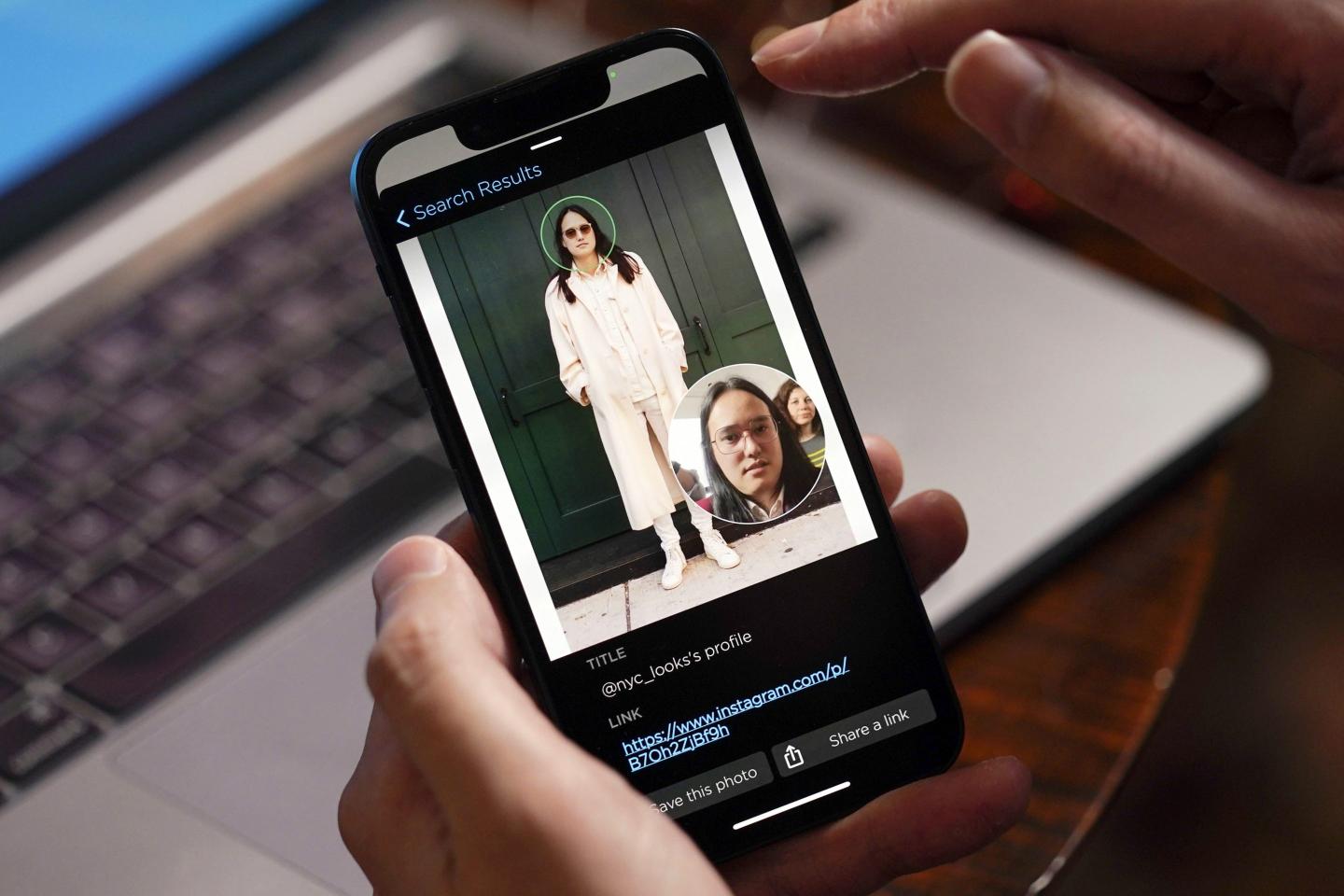 smartphone screen shows facial-recognition software