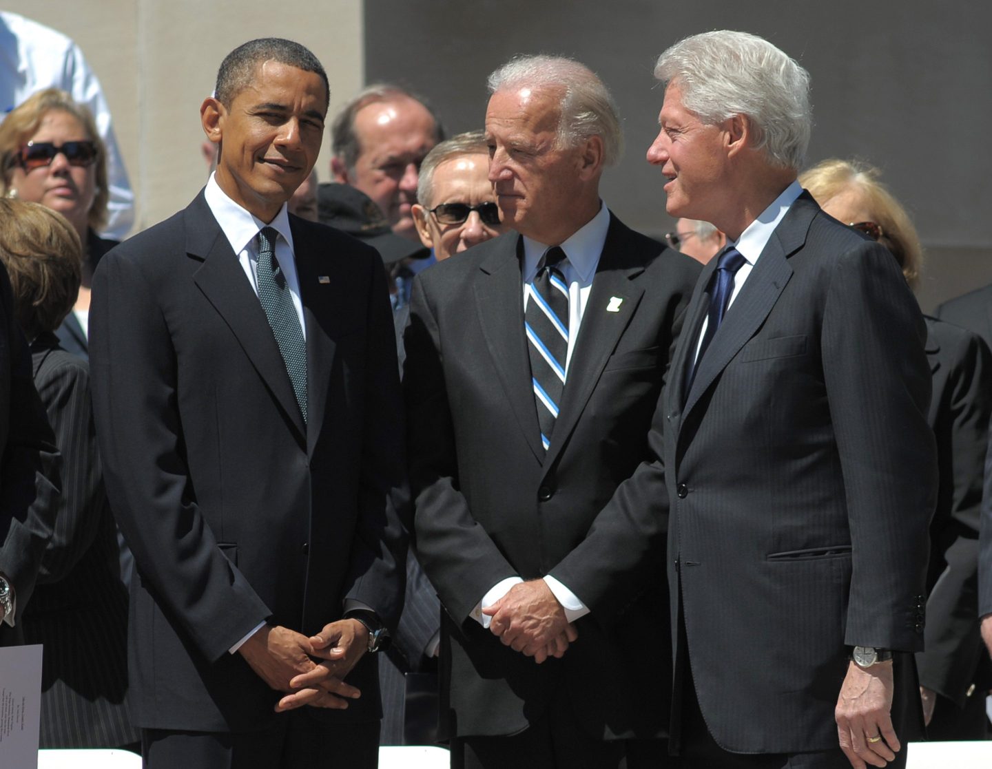From left, in this Friday, July 2, 2010, file photo, then-President Barack Obama, then-Vice President Joe Biden, and former President Bill Clinton chat before the start of a memorial service for Sen. Robert Byrd, D-W.Va., at the West Virginia State Capitol in Charleston.