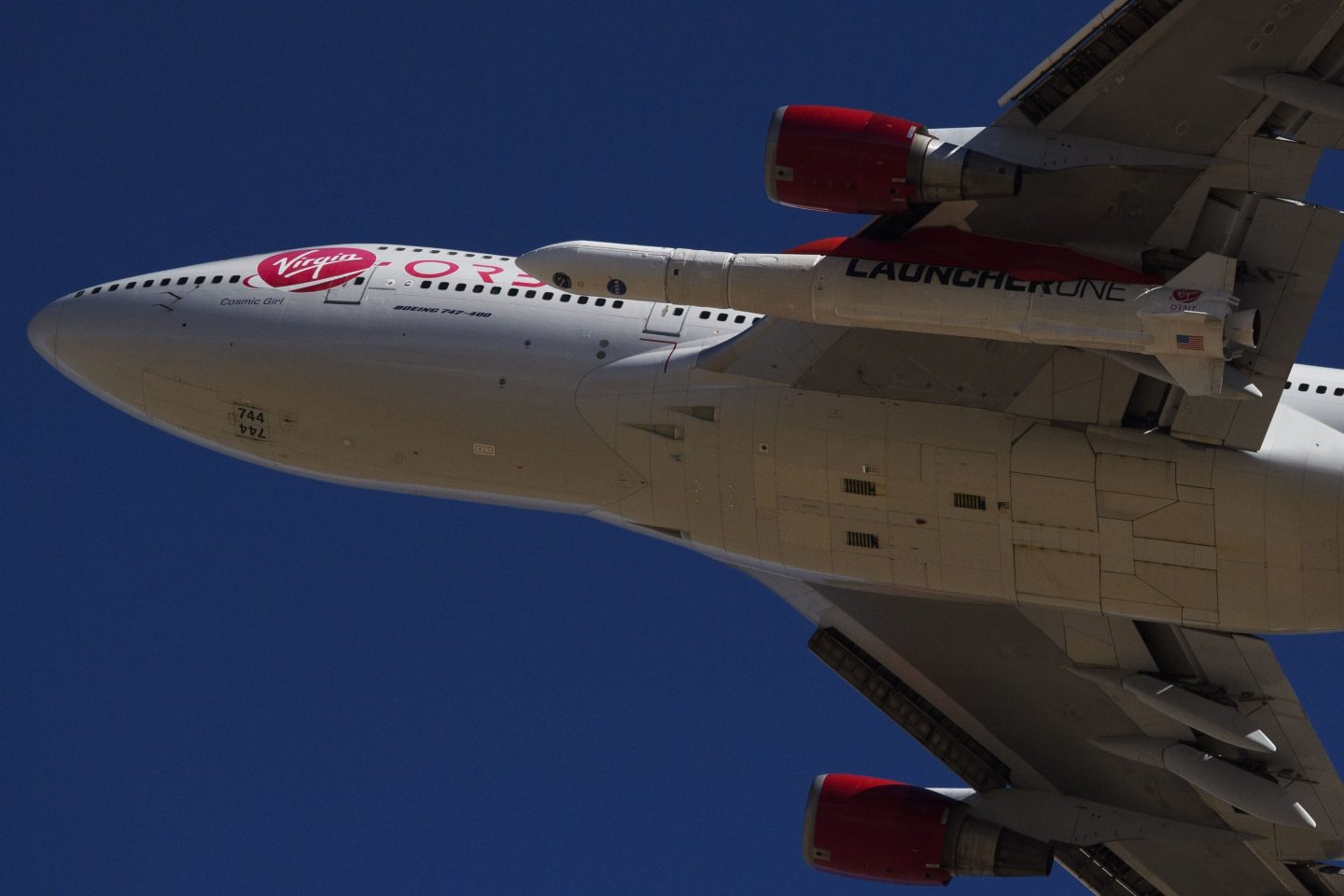 plane carrying rocket under wing