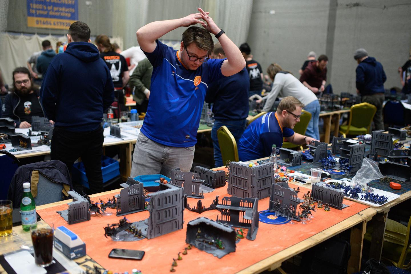 A wargamer representing the Netherlands national team (C) competes in the Warhammer 40,000 International Team Tournament held at Northampton County Cricket Ground in Northampton.