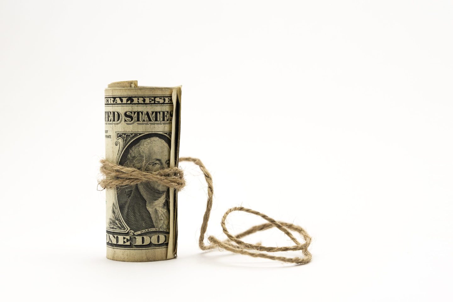 roll of dollars wrapped in string