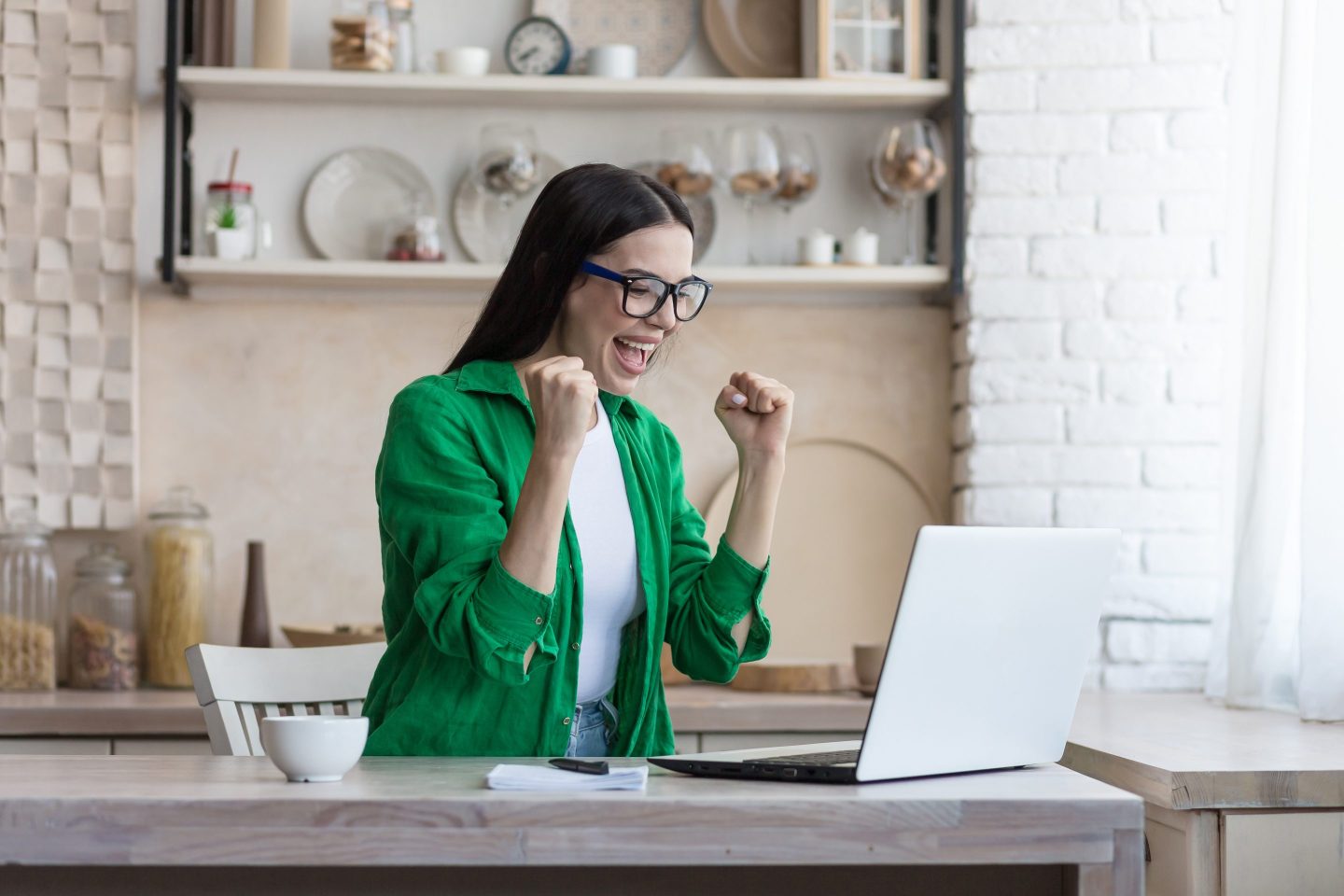 Business woman happy at her desk at home