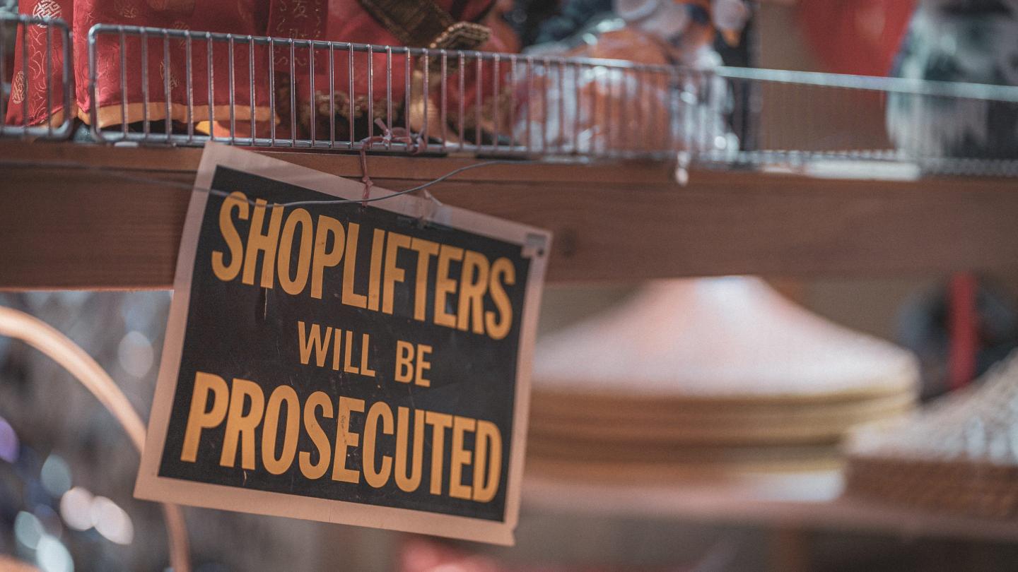 sign that says shoplifters will be prosecuted