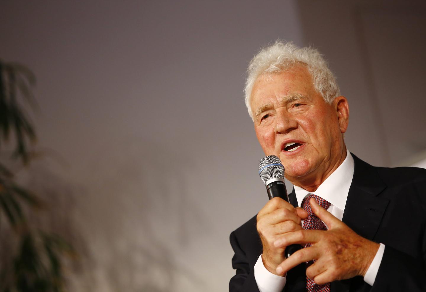 businessman Frank Stronach speaks with microphone