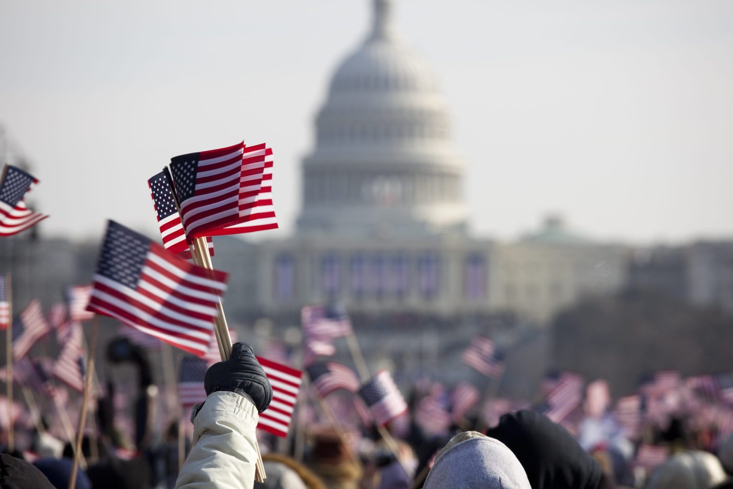 A crowd raises flags at the inauguration of President Barack Obama, January 20th 2009.