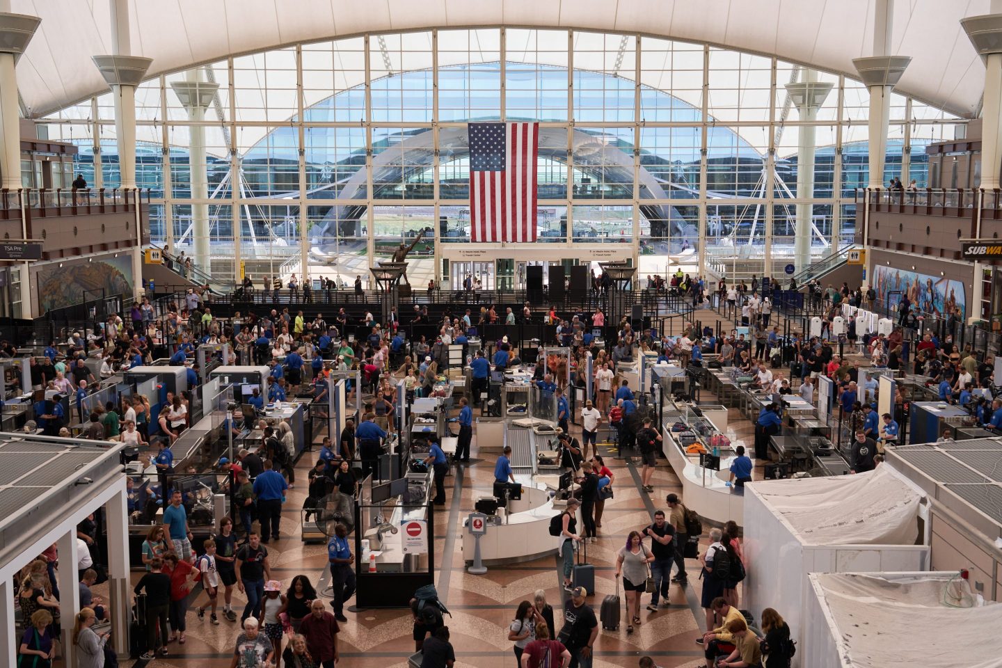 Long lines crowd TSA checkpoint at Denver International Airport.