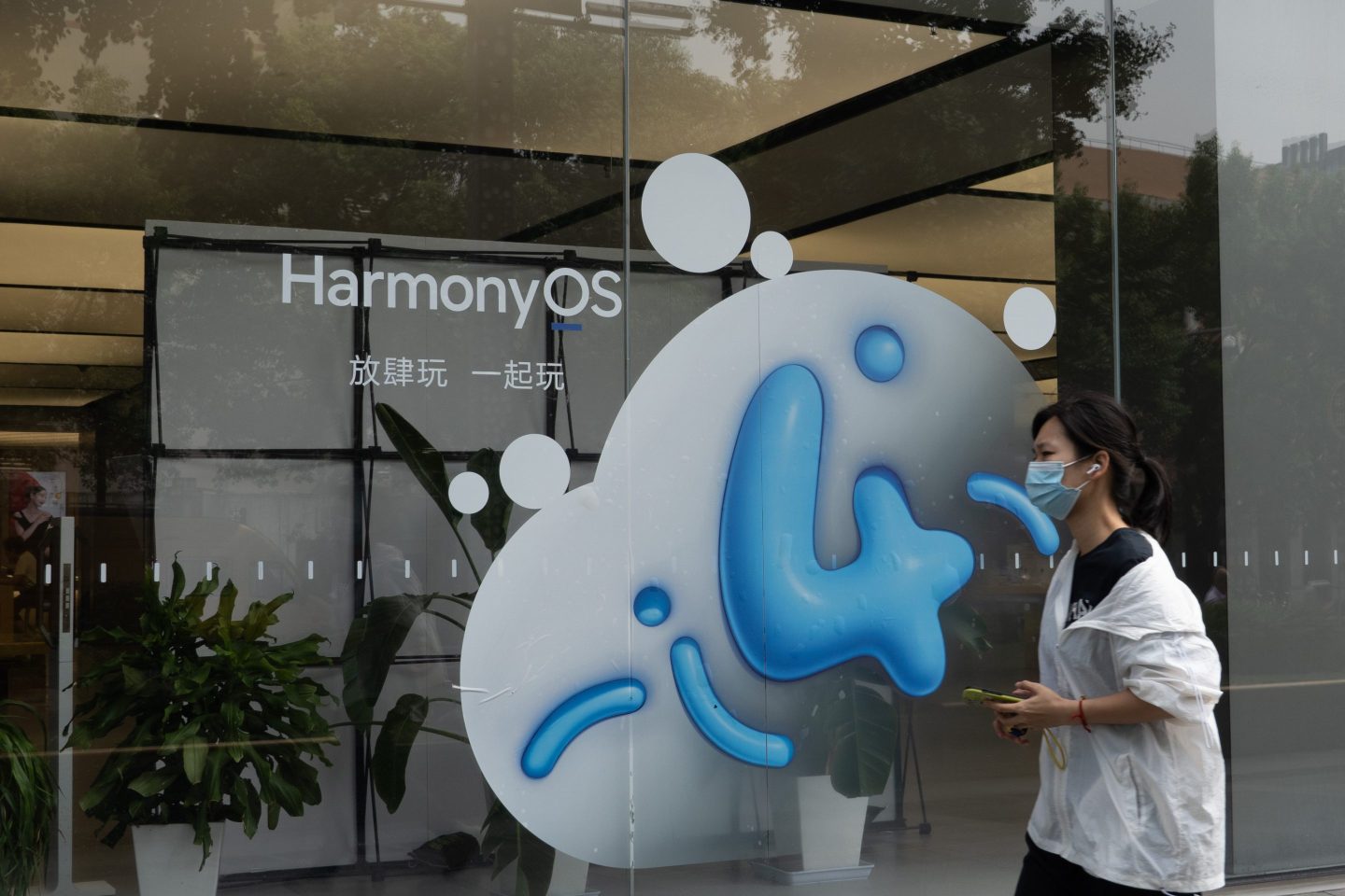The HarmonyOS logo displayed outside a Huawei store in Shanghai in September 2023.
