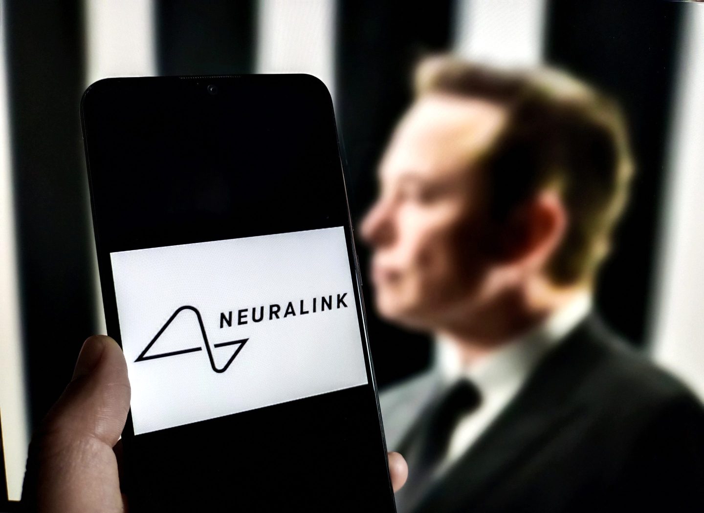 Phone screen with Neuralink logo