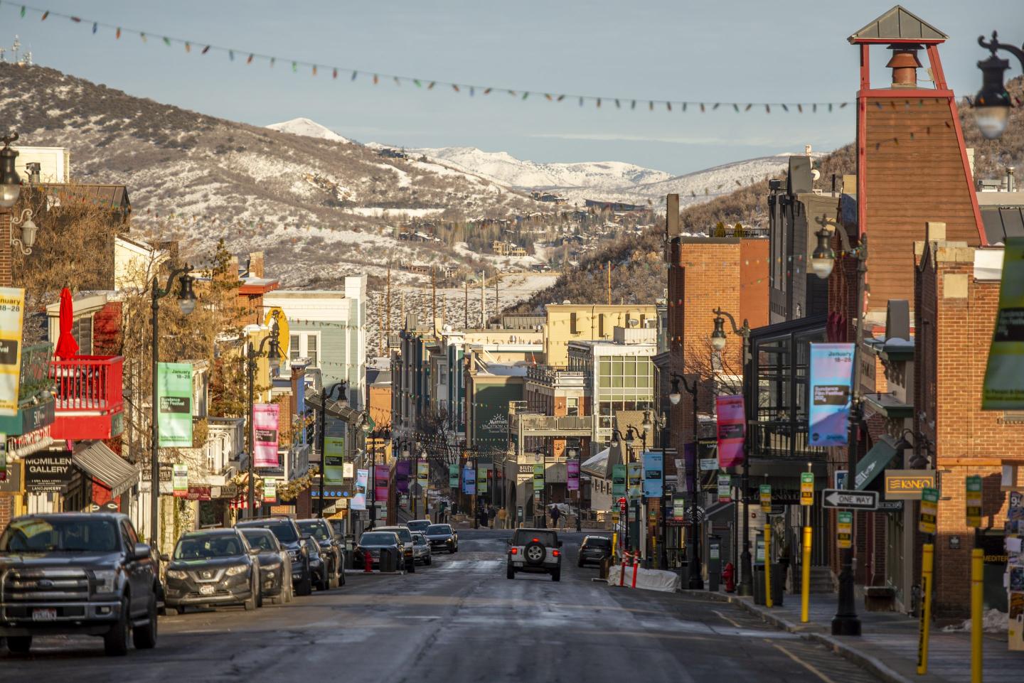 A view of Main Street Park City Utah on the last morning of the Sundance Film Festival 2024 with sun shine hitting buildings on the street.