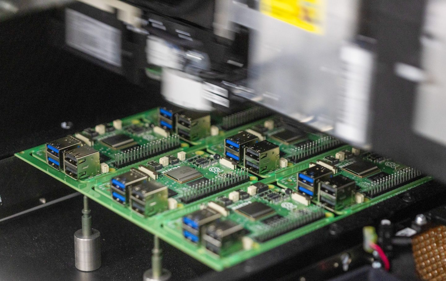 A template base carrying Raspberry Pi personal computers inside an automated machine on the production line at the Sony UK Technology Centre