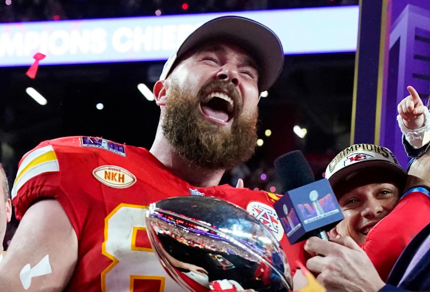 Travis Kelce at a podium
