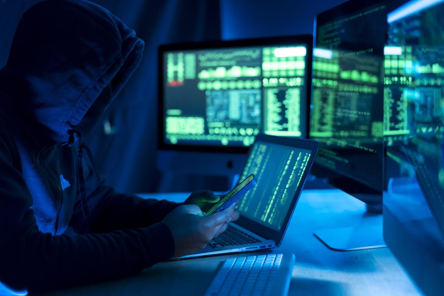 Hacker, IT and person with code on computer, programming and phishing scam with malware or virus.
