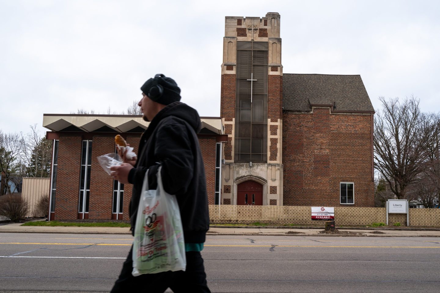 A man walks by a closed church in downtown Lansing, Michigan on Apr. 1.