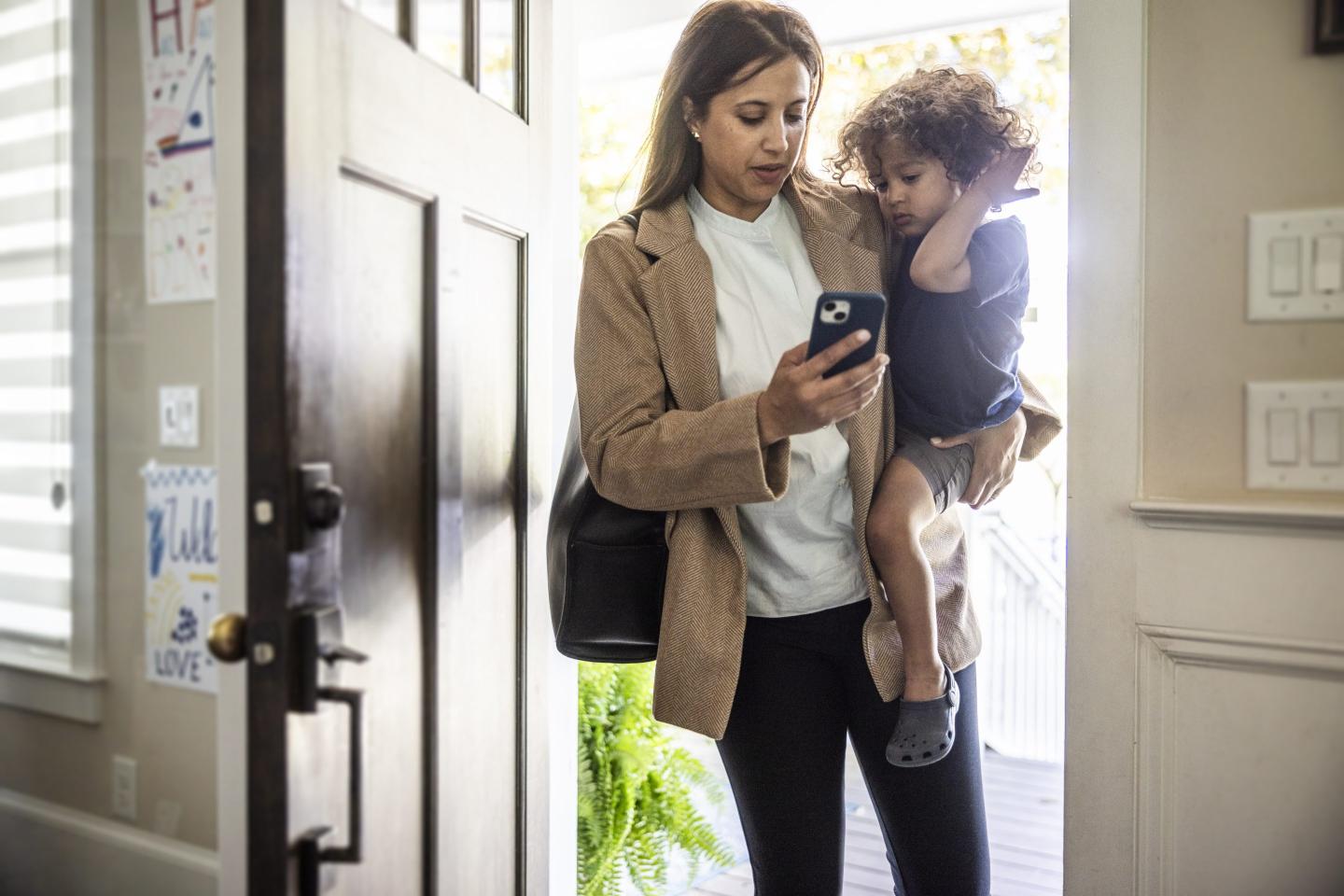 Mother with child coming home
