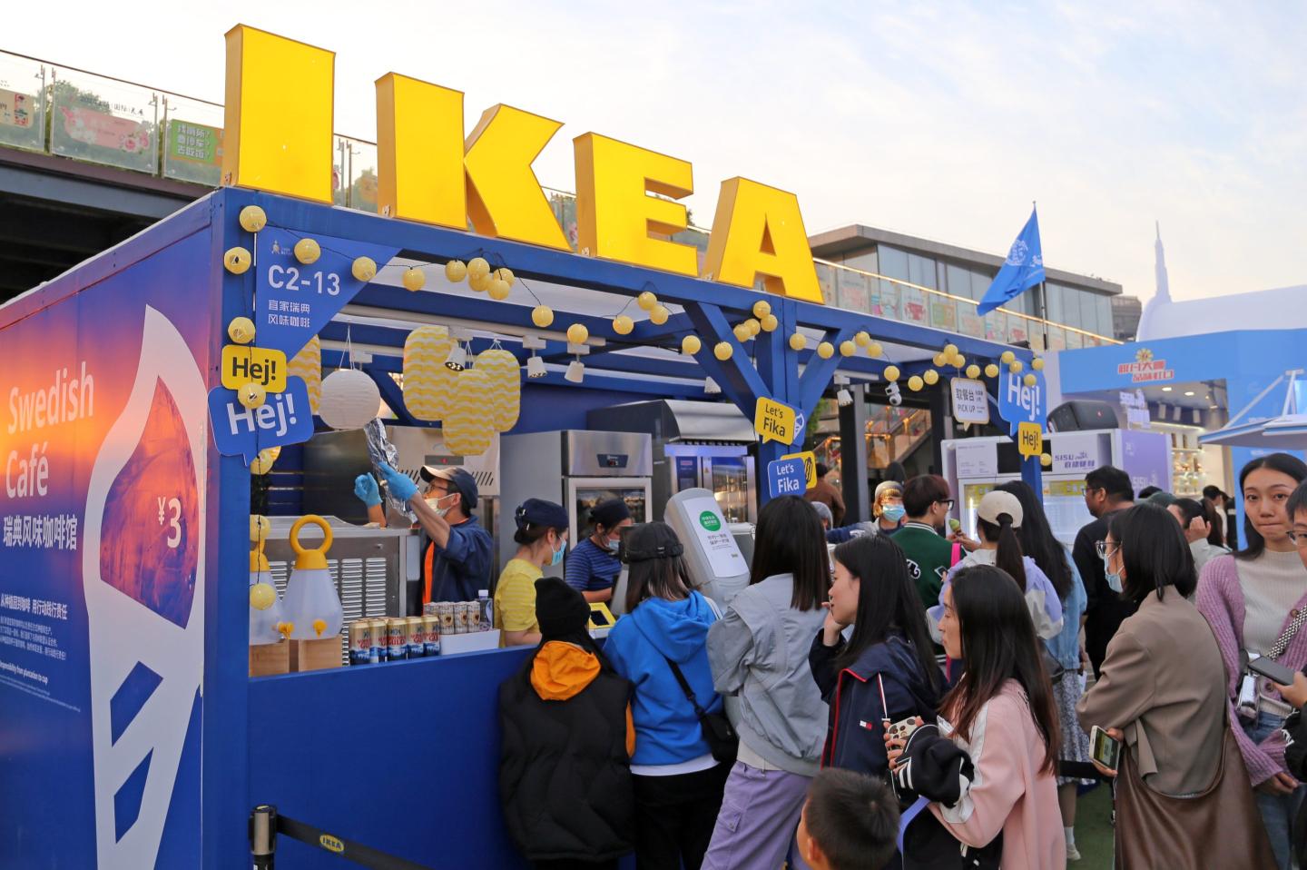 Visitors stand in line at an IKEA coffee shop